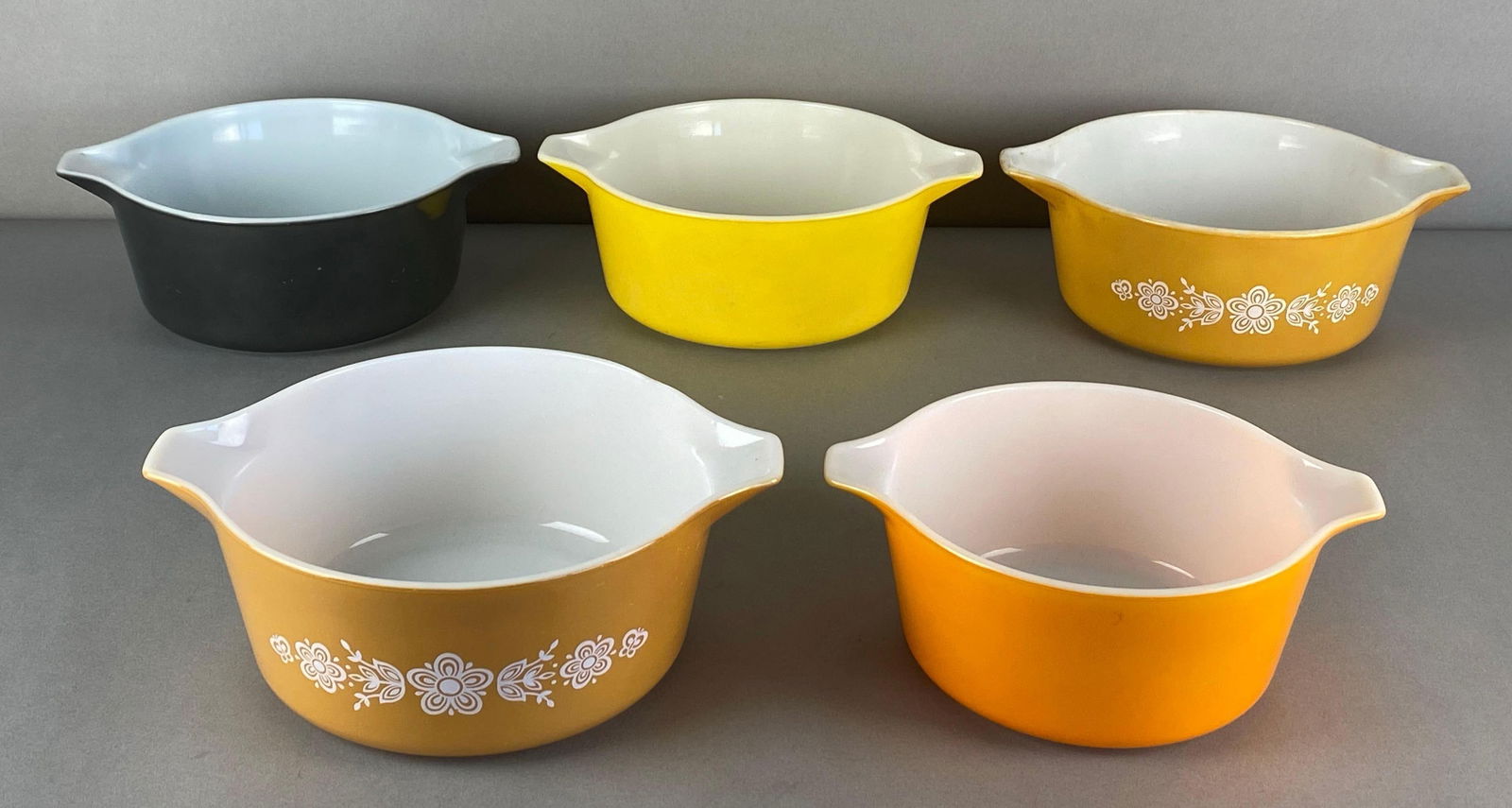 Group of 5 Pyrex Bold Color Glass Casserole Dishes: All marked on base, largest measures 10 3/4 x 8 3/4 x 4 inches