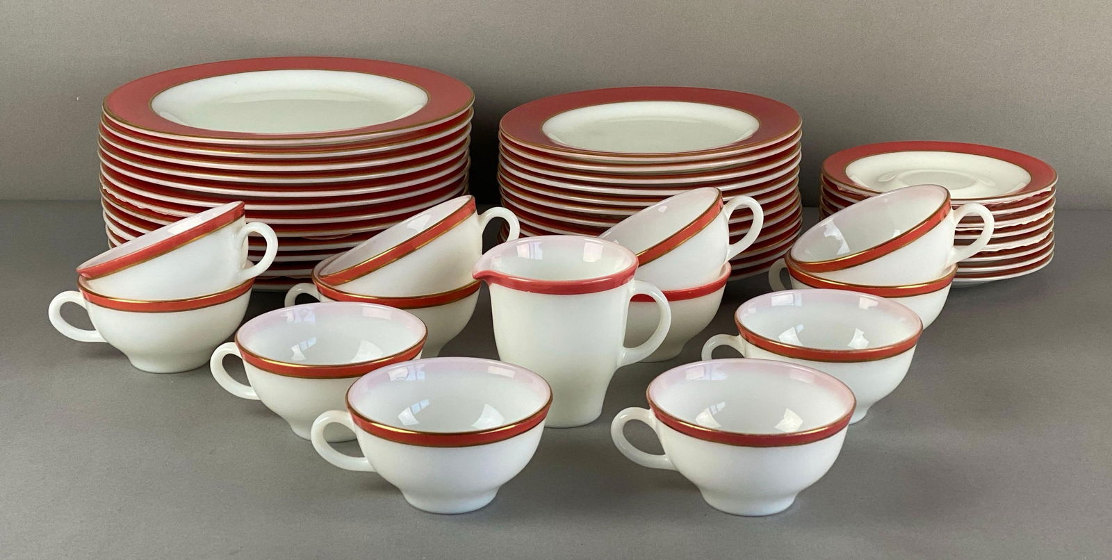 Set of Pyrex Glass Dinnerware: All marked on base, includes dinner plates, salad plates and teacups and saucers, largest measures 10 inches in diameter