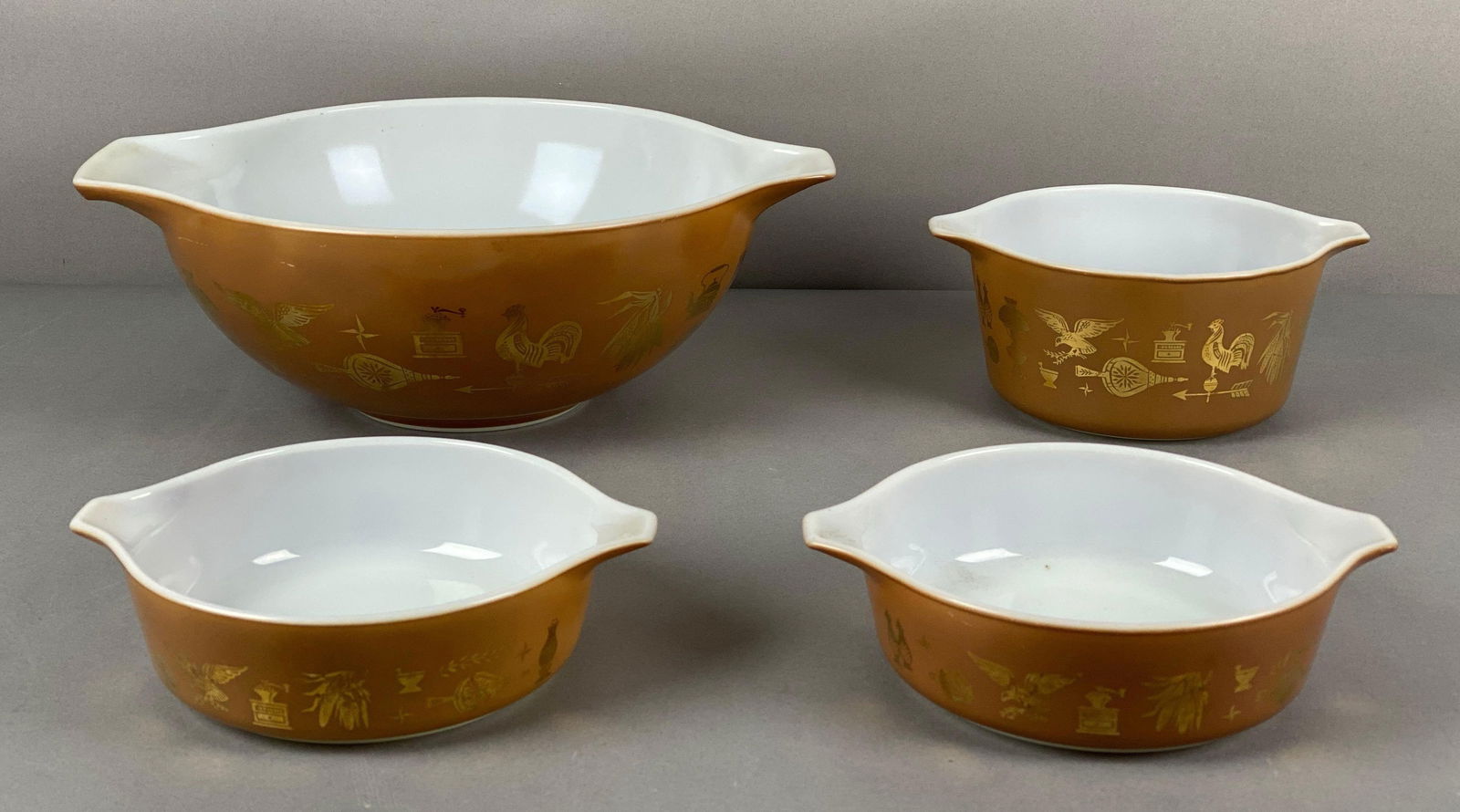 Set of 4 Pyrex Cinderella Early American Glass Nesting Mixing Bowls: all marked on base, largest measures 13 x 10 1/2 x 4 1/2 inches