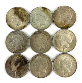 Group of 9 US Silver Peace Dollars