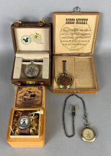Group of 4 Disney Mickey Mouse Watches: All limited editions, Includes Rodeo Mickey, Walt Disney World Tour, Western Mickey, and Inaugural Voyages, 3 with display cases, Largest case measures 5 3/4 x 5 3/4 x 1 3/4 inches.