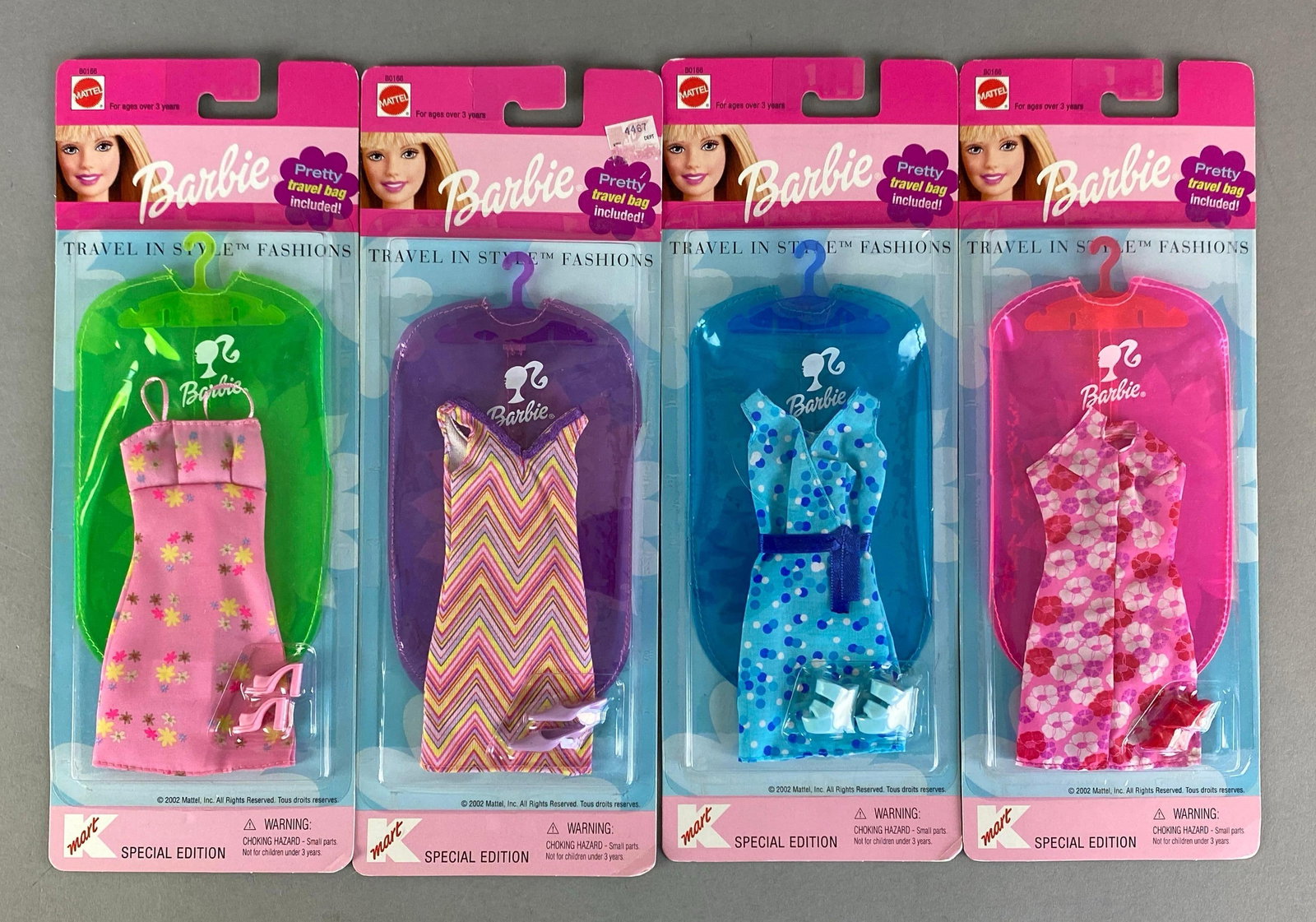 Group of 4 2002 Mattel Barbies Travel In Style Fashions Doll Outfits: Like new in packaging, Includes Pink, striped, blue and pink floral dress, all fit 11 1/2 inch dolls