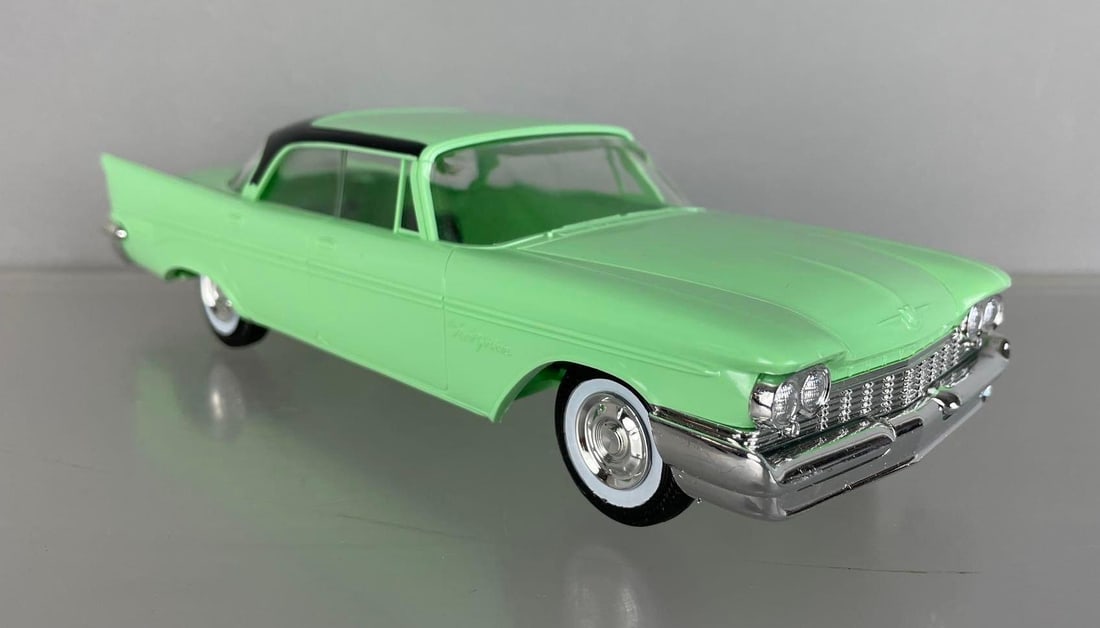 Johan Reissued 1959 Chrysler 4 Door Hardtop Dealership Promo Car: Green and black, torsion bar chassis marked, produced in 70s, original box and tissue, excellent condition