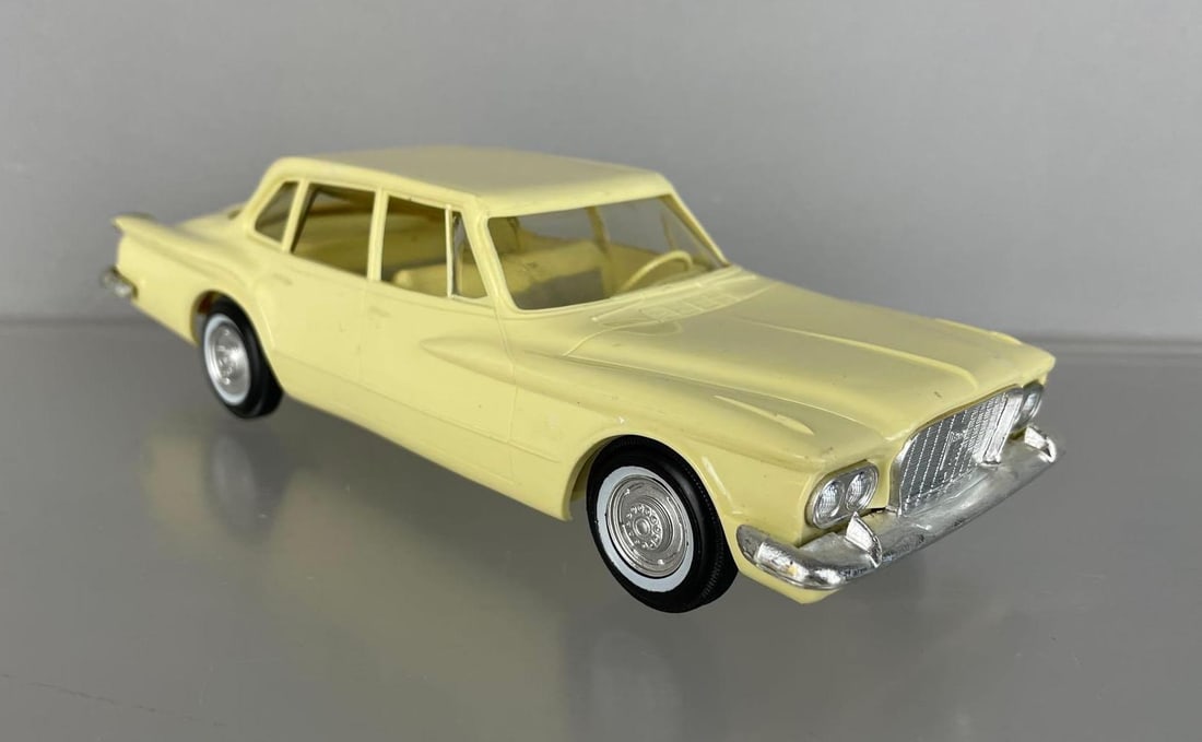 1960 Plymouth Valiant 4 Door Sedan Yellow Dealership Promo Car: Good finish, minor warp, missing rear license plate, missing side of front bumper, coaster, satin patina on chrome