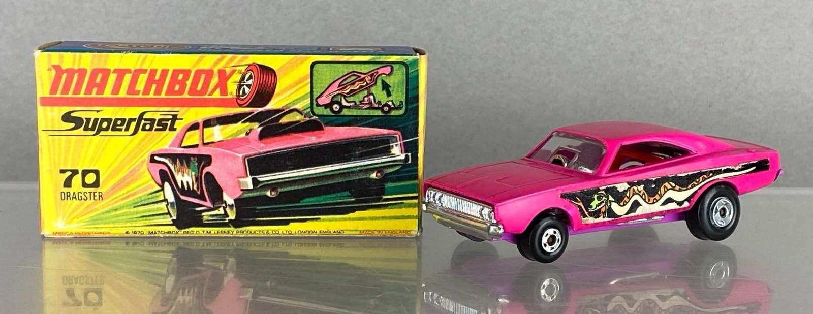 Matchbox Superfast No. 70 Dragster: A Lesney Product, With original box, Hot Pink body, Purple base, Clear windows, Black plastic wheels, Die-Cast, Made in England.