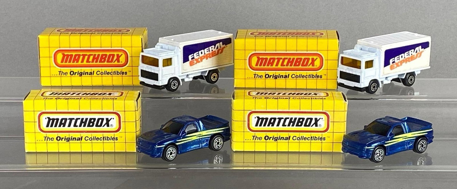 Group of 4 Matchbox Die-Cast Vehicles: With original boxes, Includes No. 13 The Buster, And No. 23 Volvo Container Truck.
