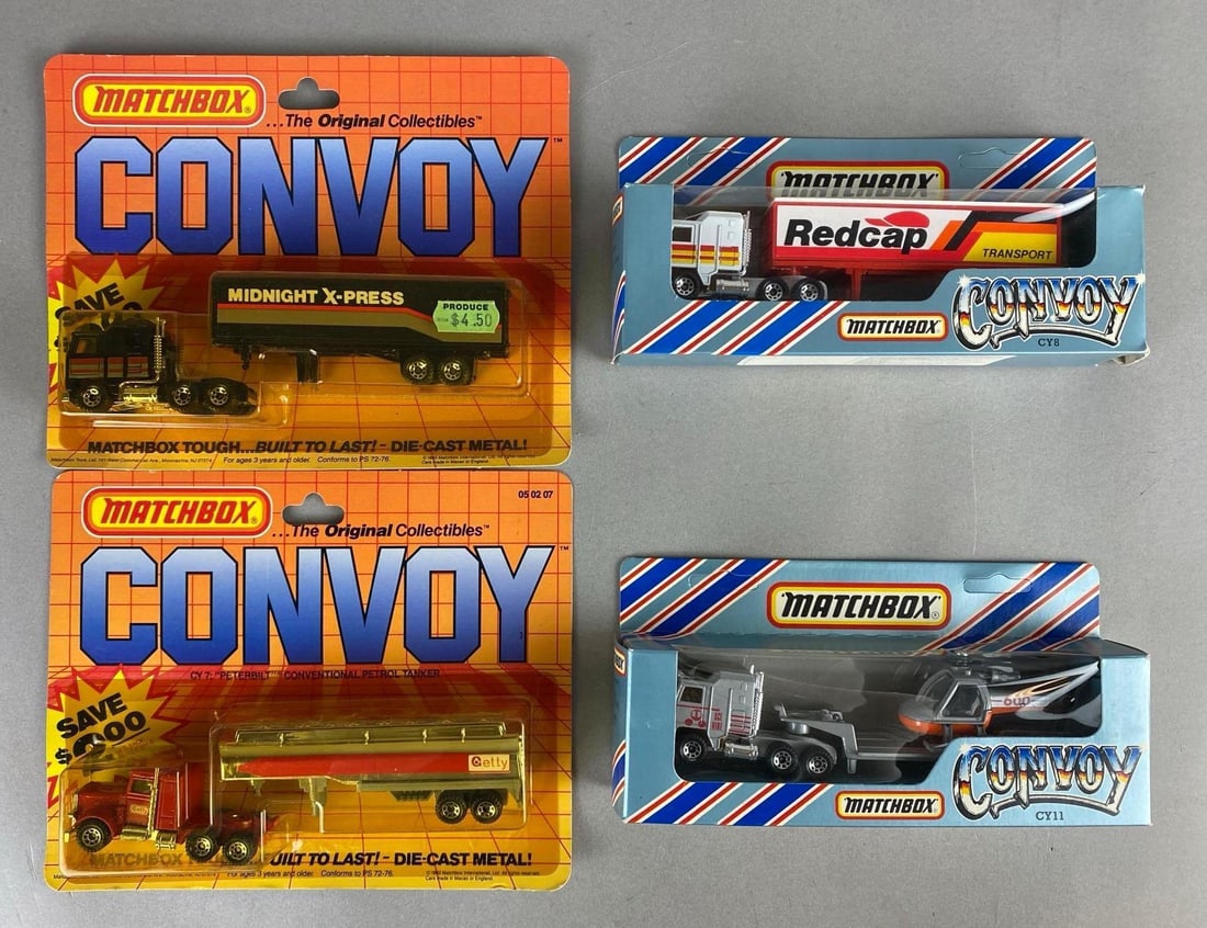 Group of 4 Matchbox Convoy Die-Cast Vehicles: Includes No. CY8 Kenworth Box Truck, No. CY11 Kenworth Helicopter Transport, and more, Largest packaging measures 7 x 8 1/2 x 1 1/2 inches.