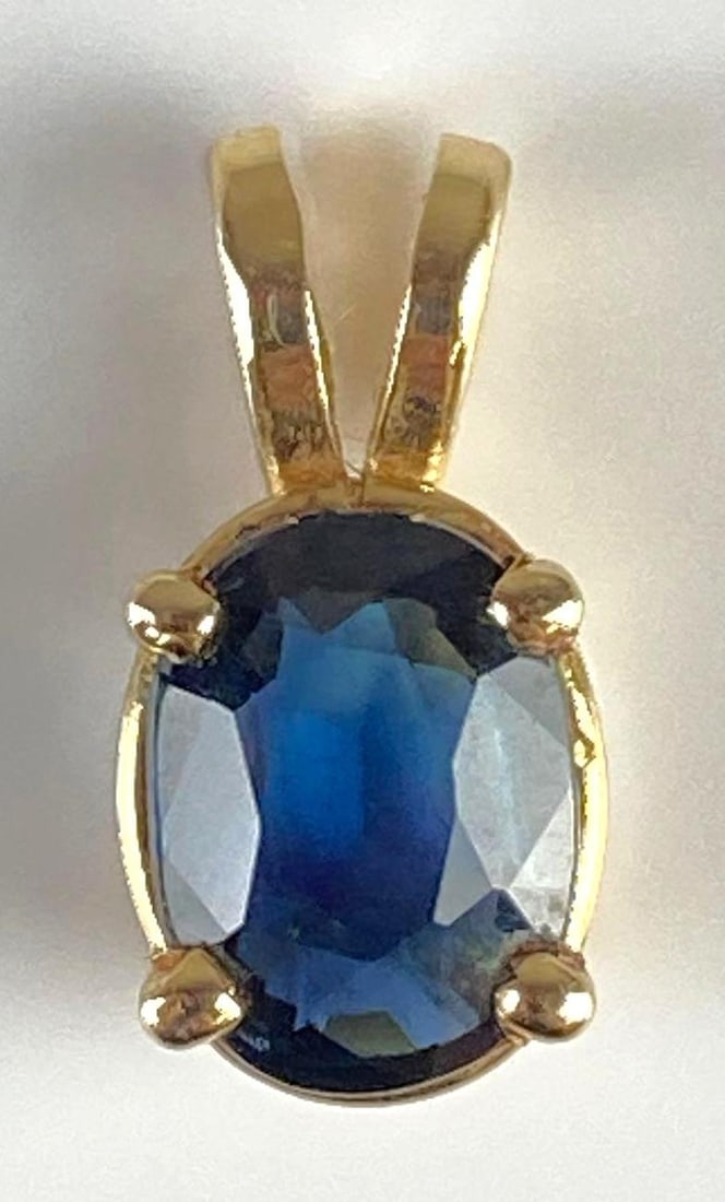 14K Gold Sapphire Necklace Pendant: Total weight 1.1g, Measures 1/2 inch long.