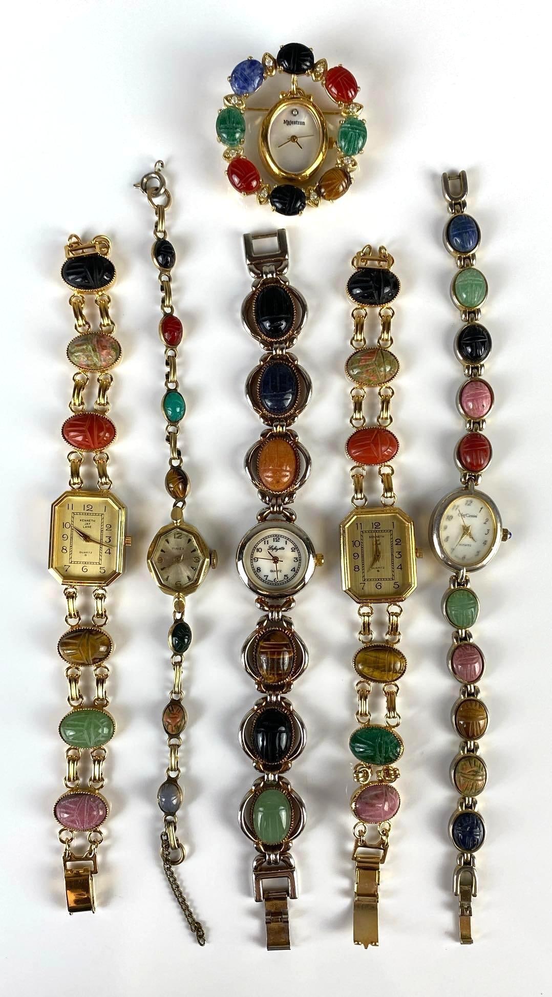 Group of Scarab Beetle Design Womens Wristwatches: Unknown working conditions, Includes Lafayette, Timex, Kenneth J Lane, and more, Largest measures 8 inches long.