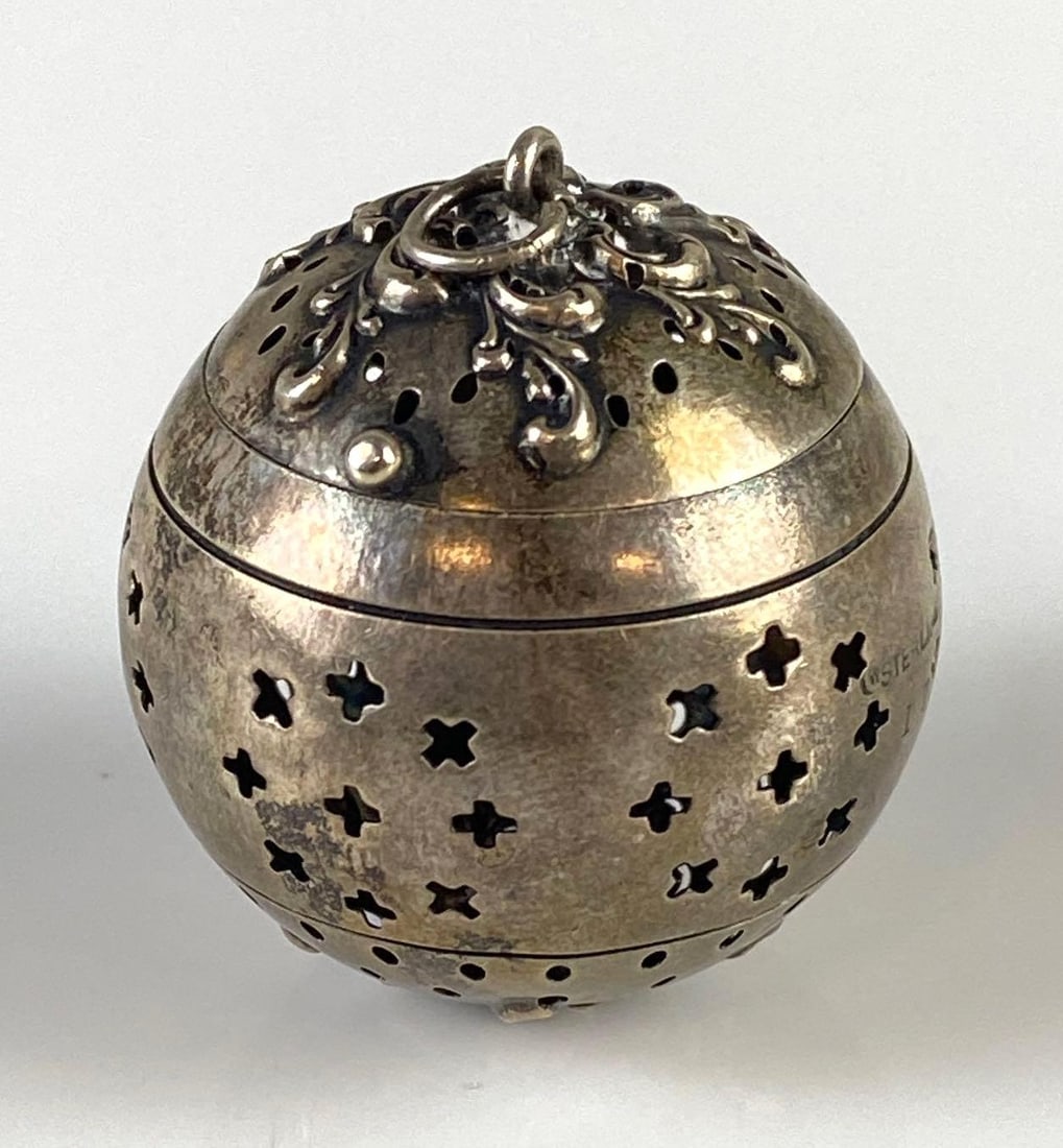 Small Sterling Silver Filagree Motif Tea Strainer: Measures 1 1/2 x 1 1/2 inches.