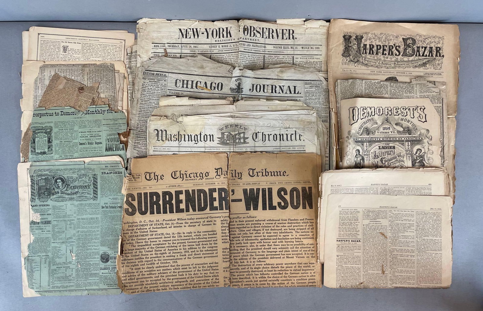 Group of Antique Newspapers and More: Includes 1865 newspapers, Harper's bazar, demorests, many torn