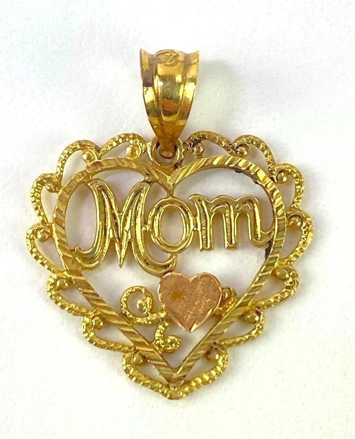 14 K Gold Mom Necklace Pendant: Measures 3/4 x 3/4 inches. Weighs 1.1 grams.