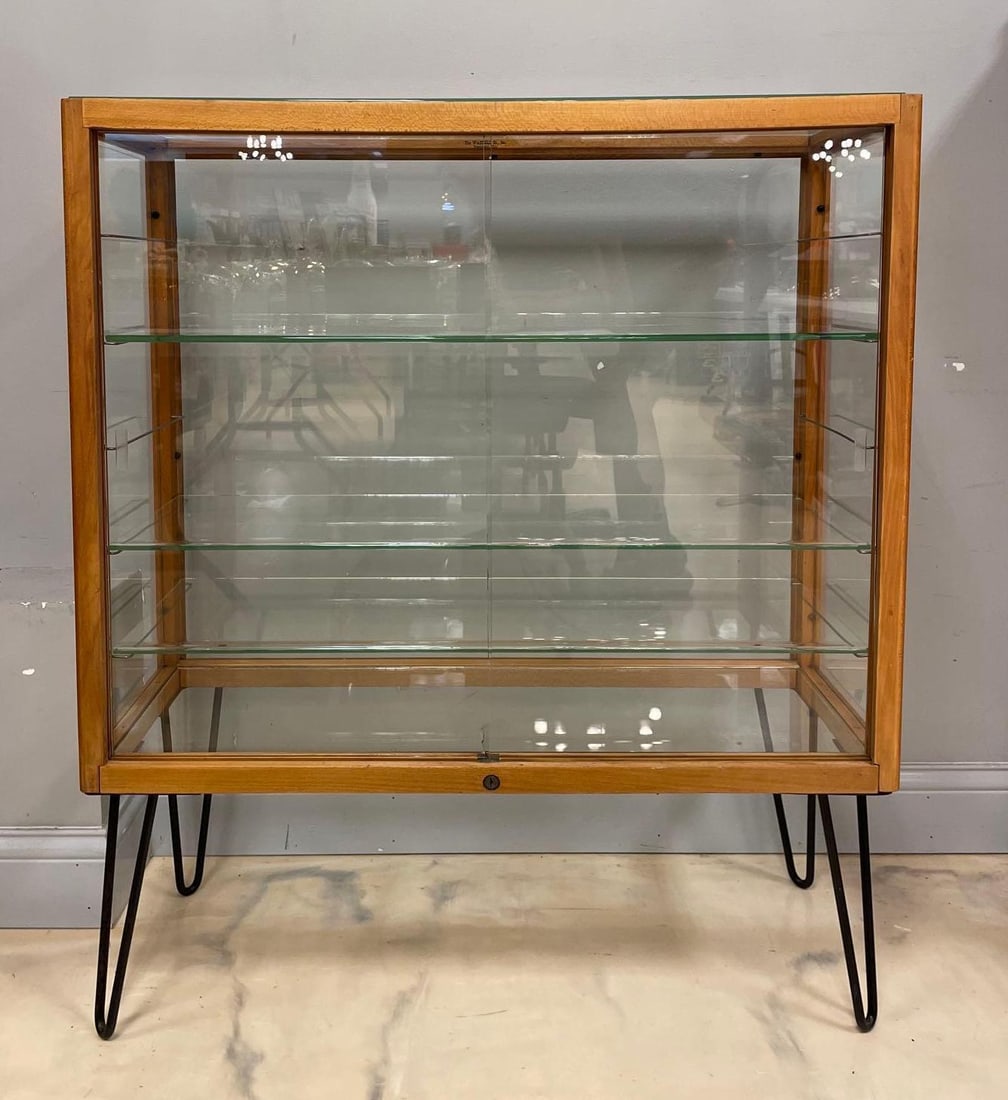 MCM Glass Display Case with Hairpin Legs: No in-house shipping available, 3rd party shipper recommended. 3 glass shelves, one door chipped by lock, measures 42 x 36 1/4 x 14 inches