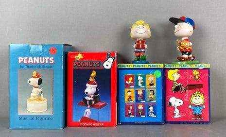 Group of 4 Hand Painted Peanuts Porcelain Figurines