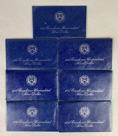 Group of 7 1970s US Mint Eisenhower Uncirculated Silver Dollars