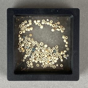 Loose glass beads in frame