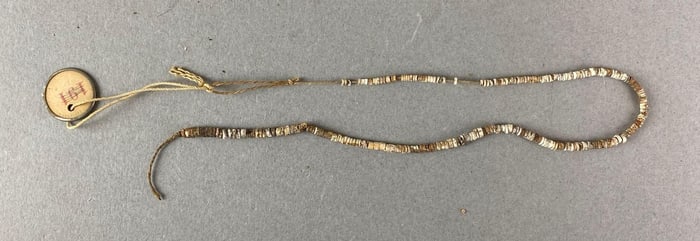 Strand of micro shell beads