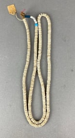 Large strand of circular shell beads, China City area, Los Angeles, California