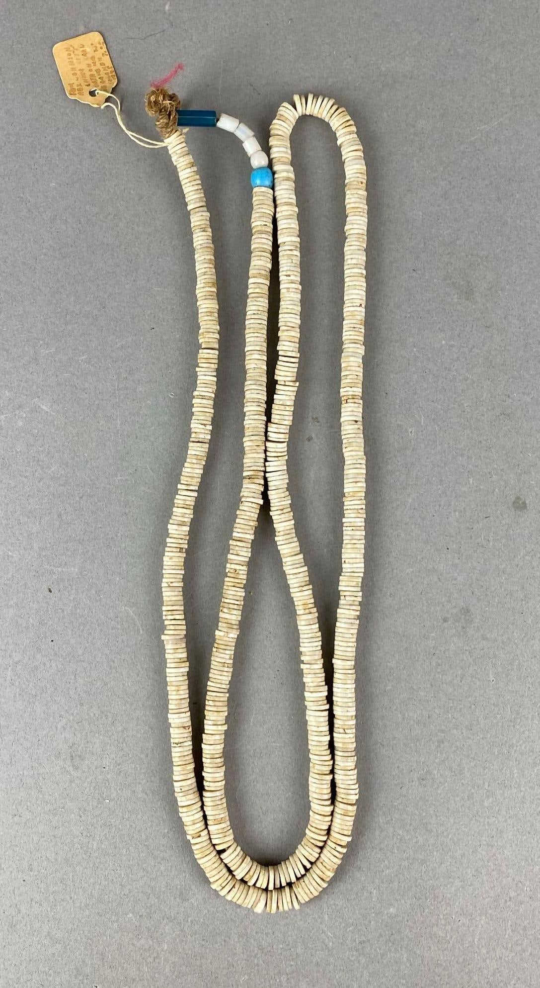Large strand of circular shell beads, China City area, Los Angeles, California: Strand measures 43 inches.