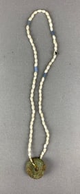 Strand of glass beads with copper gorget