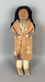 Skookum doll; wooden feet