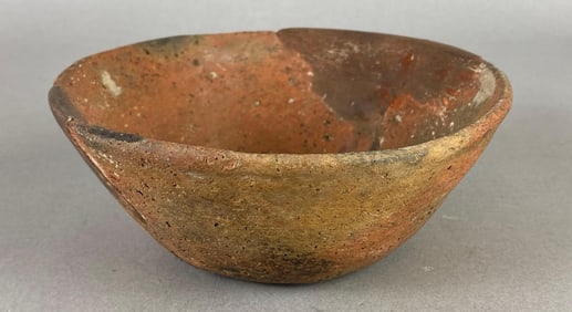 Shallow pottery bowl with rim damage, Arkansas