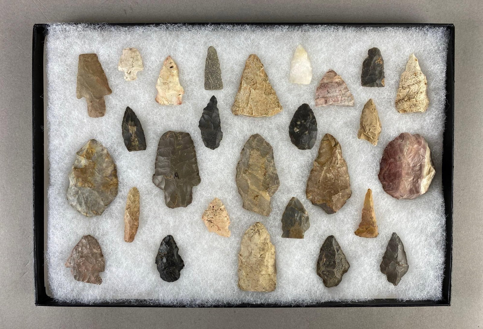 8"x12" frame of arrowheads and tools from the Midwest: Largest artifact measures 2 1/2 x 1 1/4 inches.