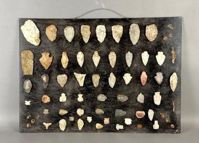 Large board of 52 arrowheads and flint tools