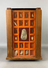 Rotating cigar display case filled with arrowheads from Marion County, Illinois