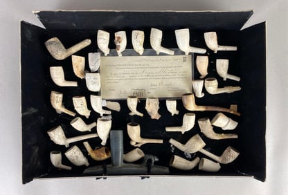 Display frame of historic meerschaum pipes