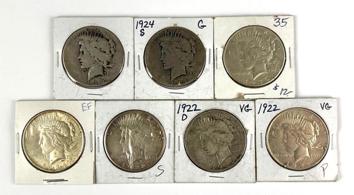 Group of 7 US Peace Silver Dollars