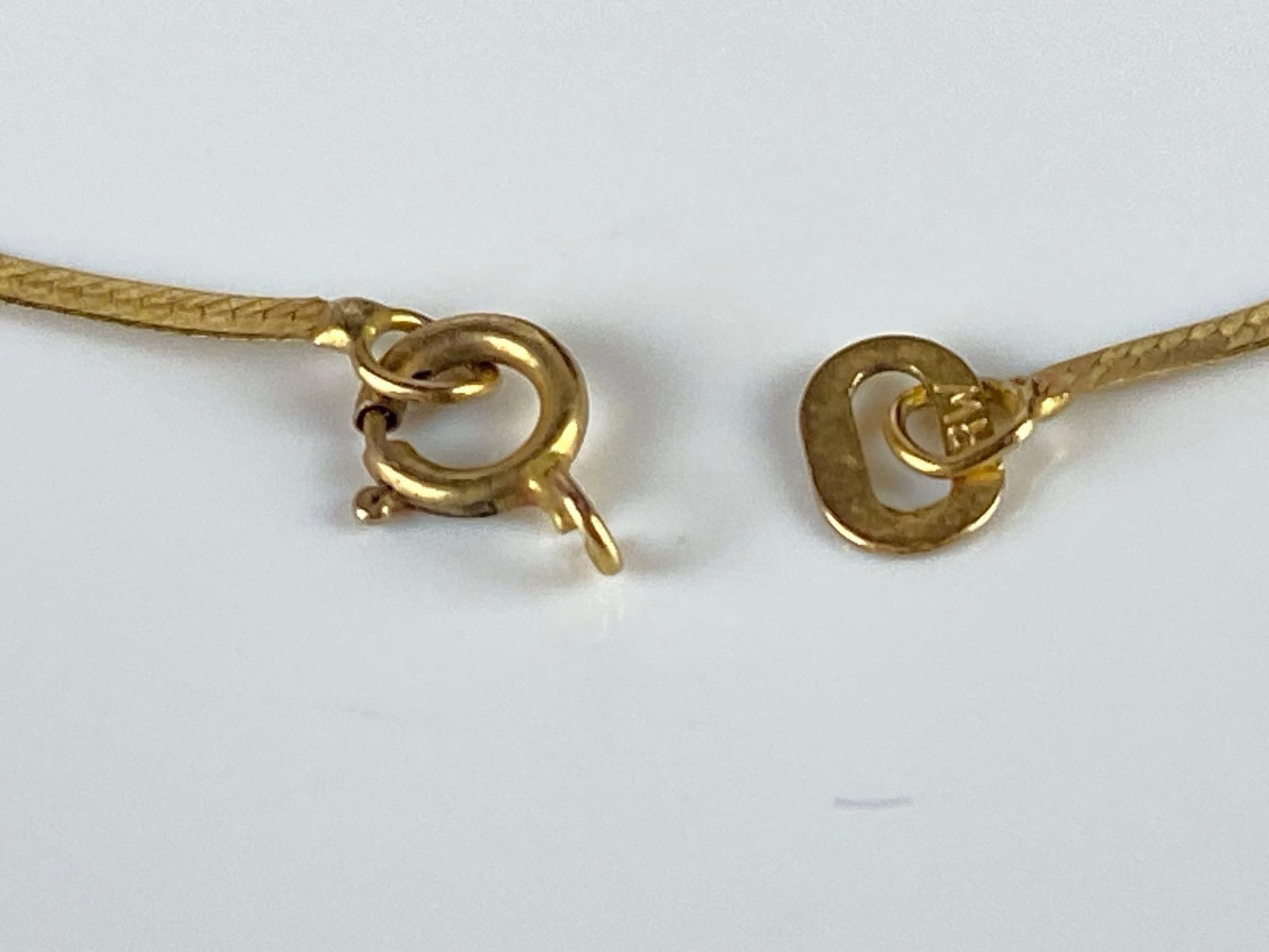 10K Gold Herringbone Chain Bracelet: Total weight 0.6g, Clasp not attached, Measures 7 1/4 inches long.