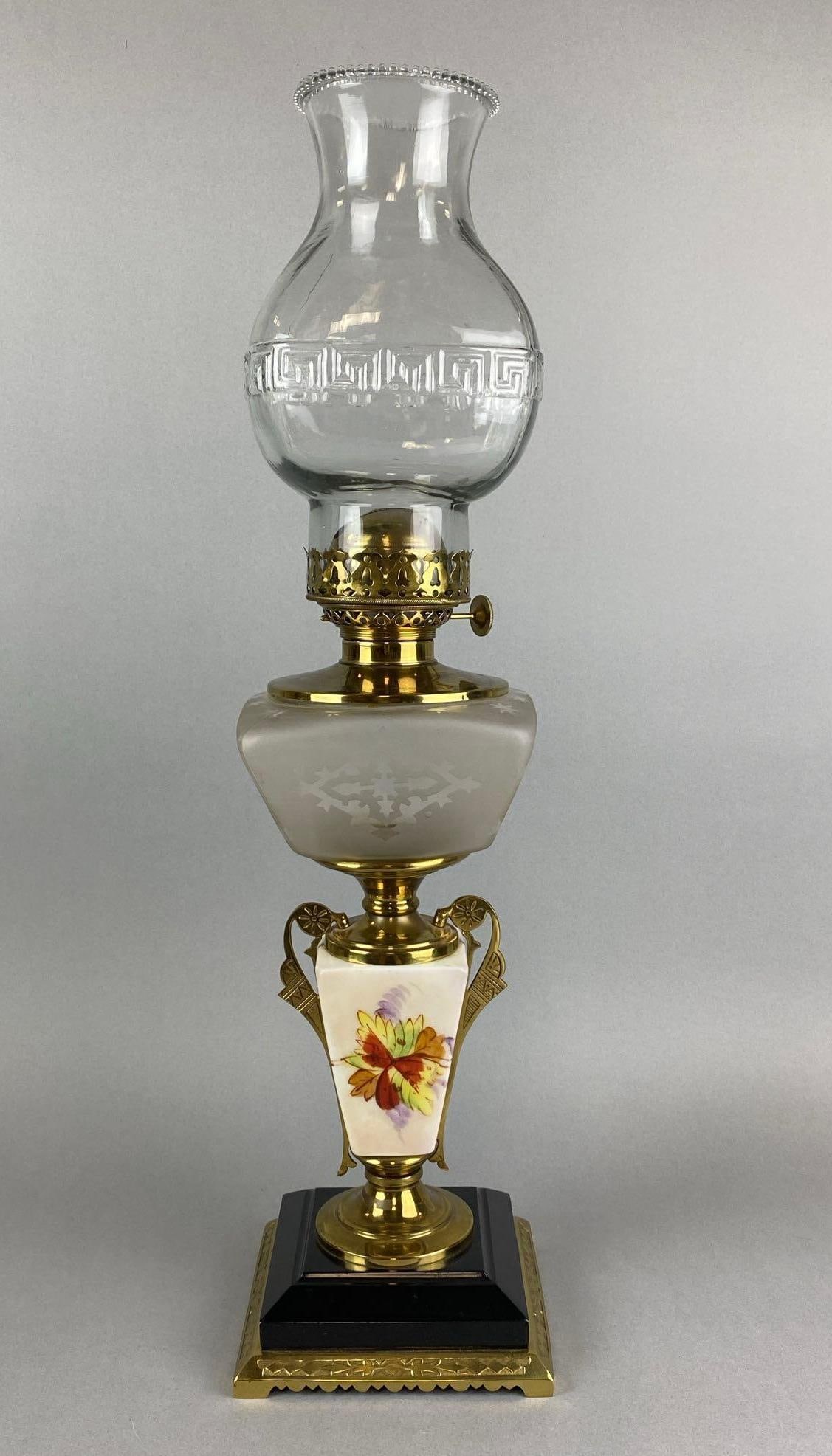 Antique Hand Painted Floral Motif Oil Lamp: Bottom rim of Chimney is chipped. Measures 23 x 5 1/4 x 5 1/4 inches.