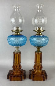 Pair of EAPG Amber and Cobalt Glass Americus Pattern Oil Lamps