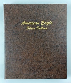 Group of 31 US Mint American Silver Eagle Coins in a World Coin Library Album