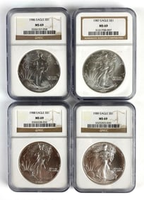 Group of 4 NGC Graded 1986-1989 US $1 Eagle Silver Dollars MS69