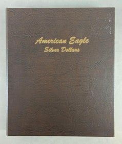 Group of 25 US $1 American Eagle Silver Dollars in Folder