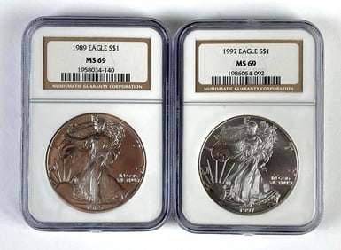 Group of 2 NGC Graded US $1 Silver Eagles MS69