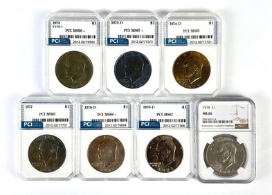 Group of 7 Graded US $1 Eisenhower Silver Dollars