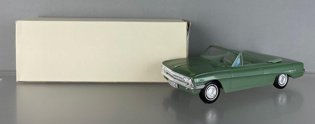 1962 Oldsmobile Cutlass Convertible Metallic Green Dealership Promo Car: Working friction Jo-Han, wrong color box, windshield sagged at drivers side