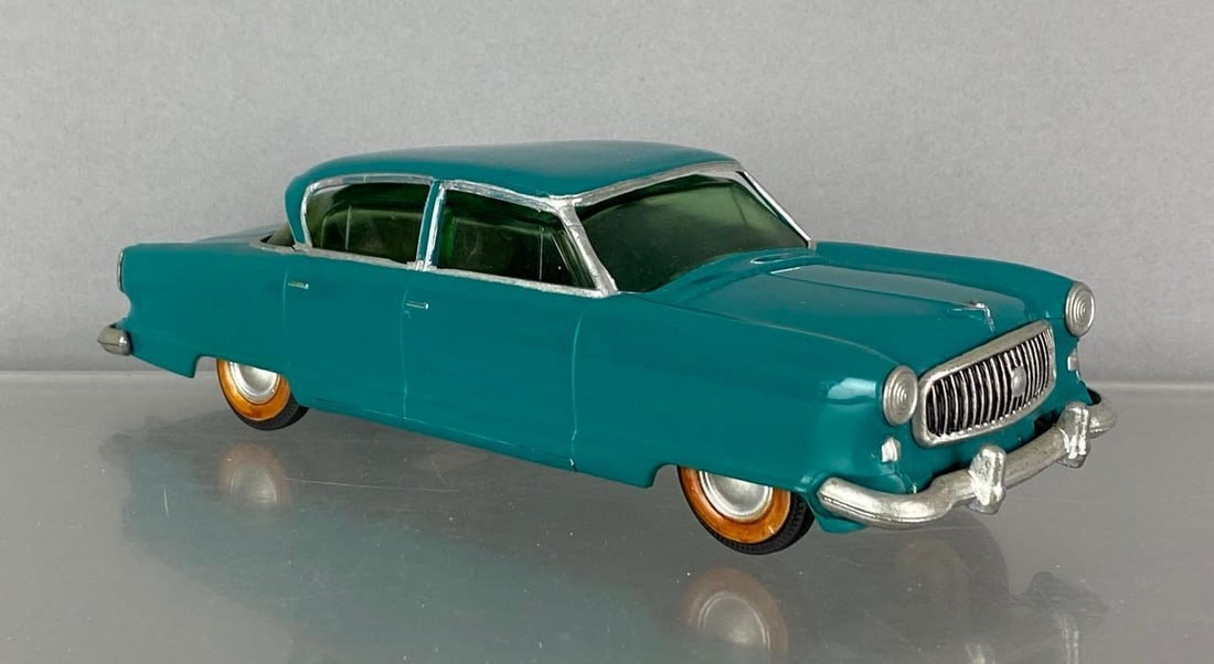 1953 Tru-Miniatures Nash Ambassador Dark Aqua Dealership Promo Car: Coaster, severe warping shown