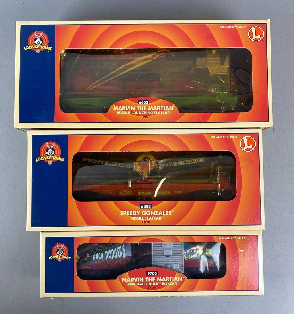 Group of 3 Lionel O Scale Looney Tunes Train Cars: Includes Marvin the Martian and Daffy Duck boxcar, speedy Gonzales Missile Flatcar and Marvin the Martian missile launching flatcar.