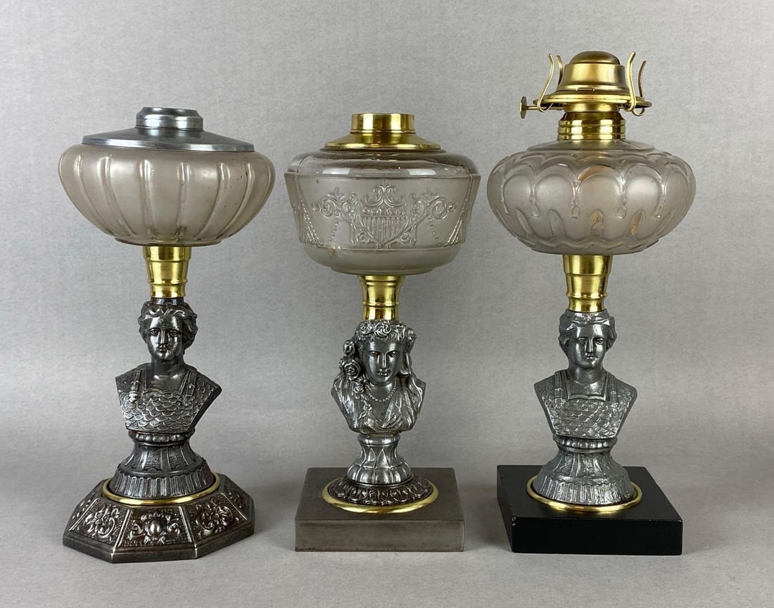Group of 3 Cast Metal Figural Busts Oil Lamp Bases: All with clear etched or embossed glass founts, Largest measures 13 1/4 x 5 1/2 x 5 1/2 inches.