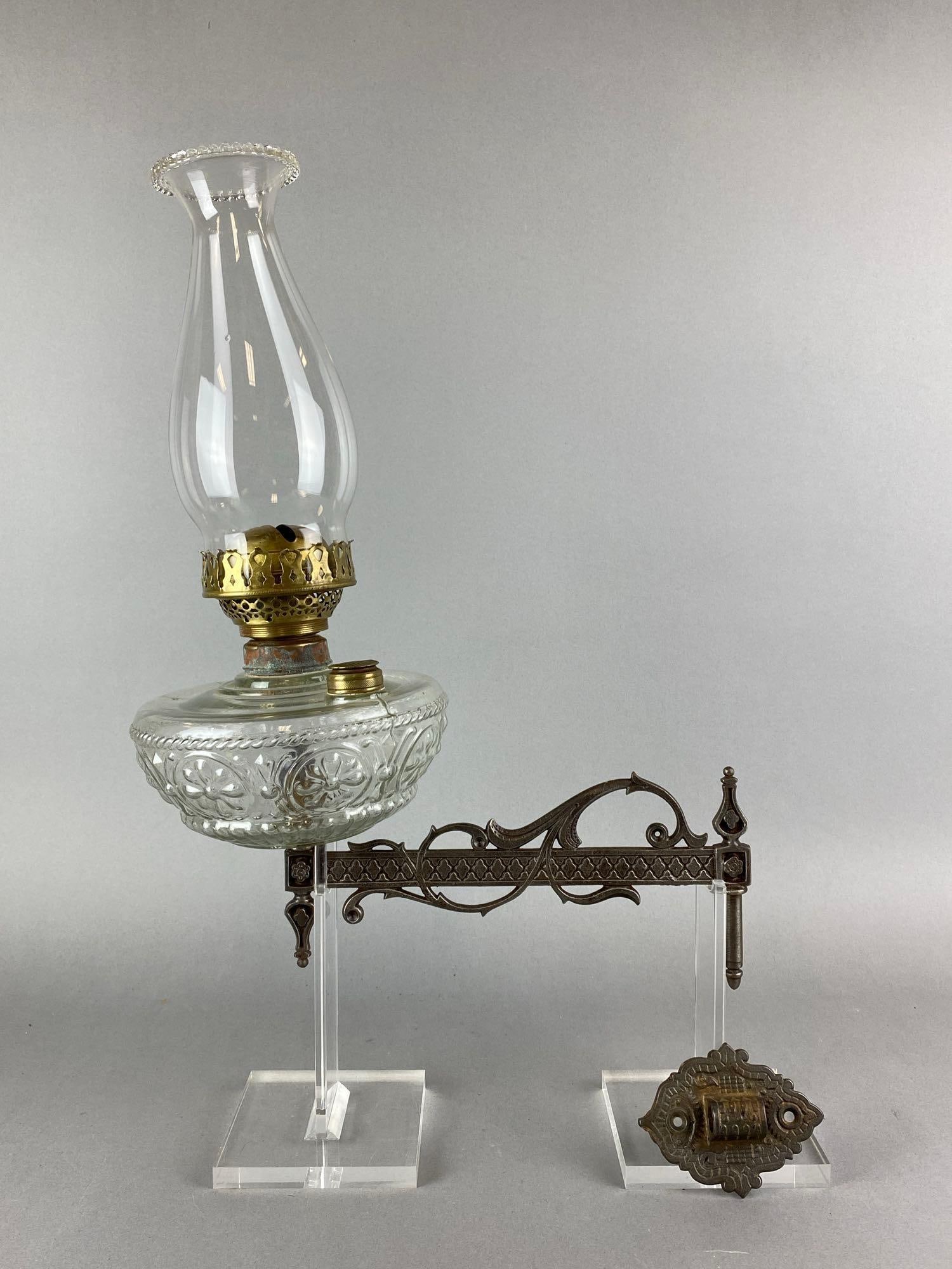 Antique Cast Iron Oil Lamp Sconce: Includes oil lamp. Oil lamps need measures 13 3/4 x 7 x 7 inches. Sconce measures 5 x 2 3/4 x 10 inches.