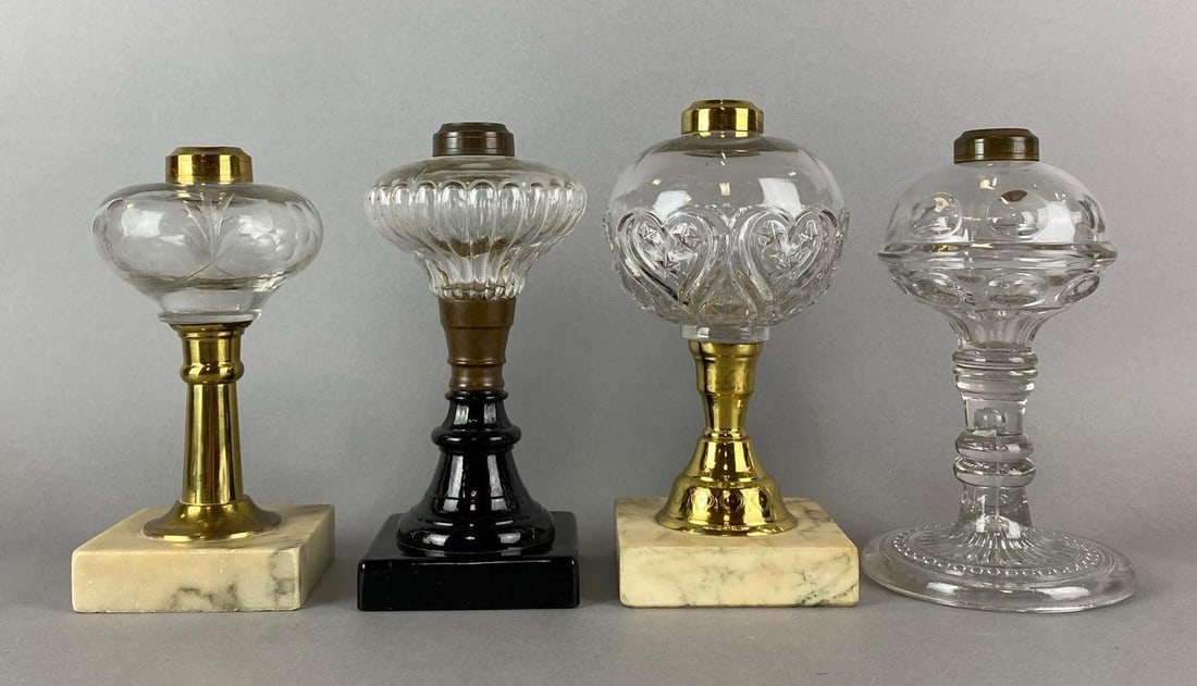Group of 4 Antique Victorian Small Glass Oil Lamps: One has a chip on the base. Both granite bases are worn. Largest measures 8 1/2 x 4 1/2 x 4 1/2 inches.