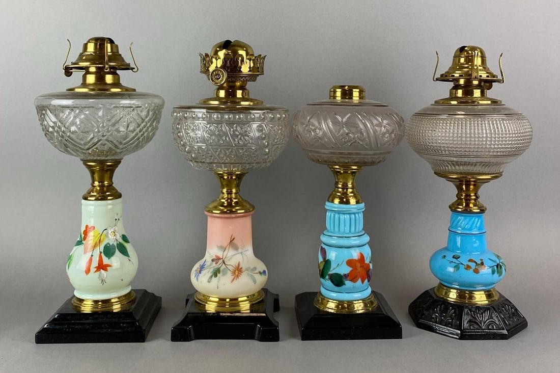 Group of 4 Antique Victorian Hand Painted Floral Motif Oil Lamps: Wear consistent with age. Largest measures 14 1/4 x 6 1/2 x 6 1/2 inches.
