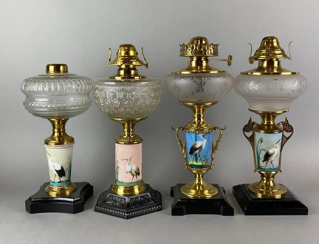 Group of 4 Antique Victorian Bird Motiff Oil Lamps: Paint has some wear. Largest measures 14 1/2 x 6 1/2 x 6 1/2 inches