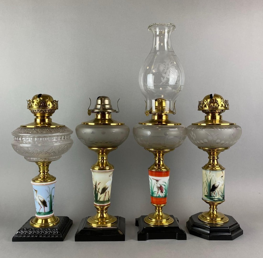 Group of 4 Antique Victorian Bird Motif Oil Lamps: One includes a Chimney. Chimney has a small chip on lower edge. Largest measures 21 1/2 x 6 x 6 inches.