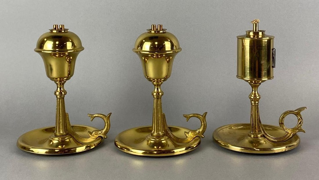 Group of 3 Whale Oil Lamps: One is missing a reflector. Largest measures 7 x 5 1/4 x 5 inches.