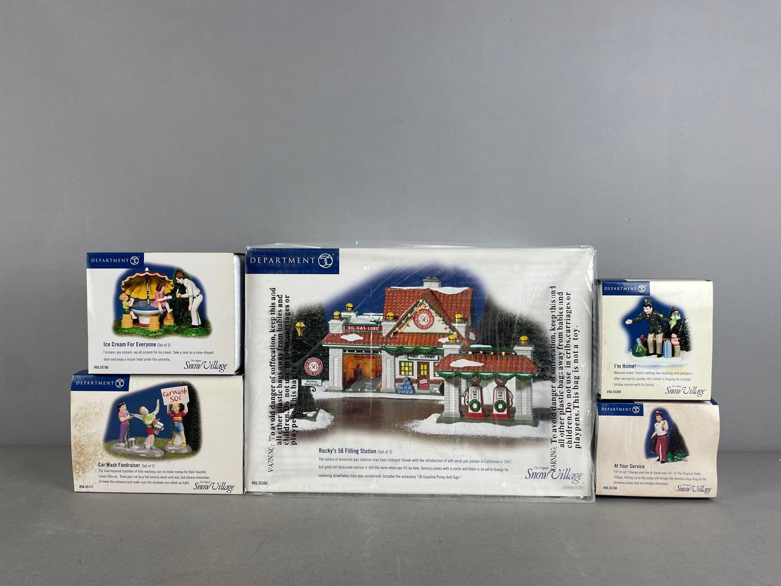 Group of Department 56 Snow Village Figurines and More: Rocky's 56 filling station packaging measures H 10" x W 13 3/4" x D 7"